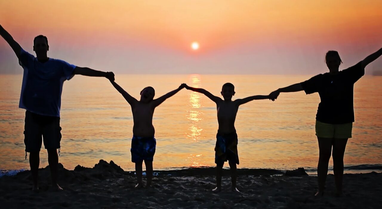 Family Joy On The Beach Depicting The Concept Of Emotion-Focused Family Therapy (EFFT) In Newfoundland And Labrador