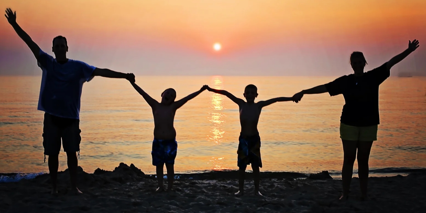 Family joy on the beach depicting the concept of emotion-focused family therapy (efft) in newfoundland and labrador