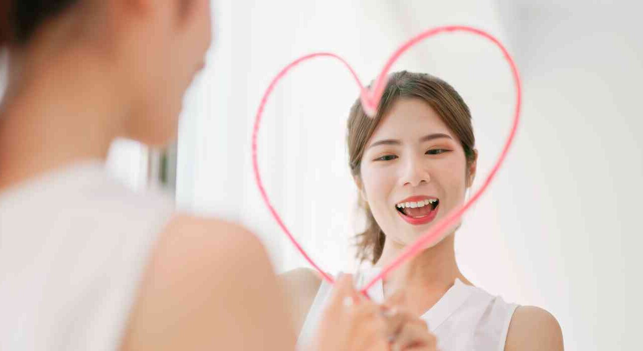 Concept Image For Bulimia Therapy - Female Draws Heart On Mirror